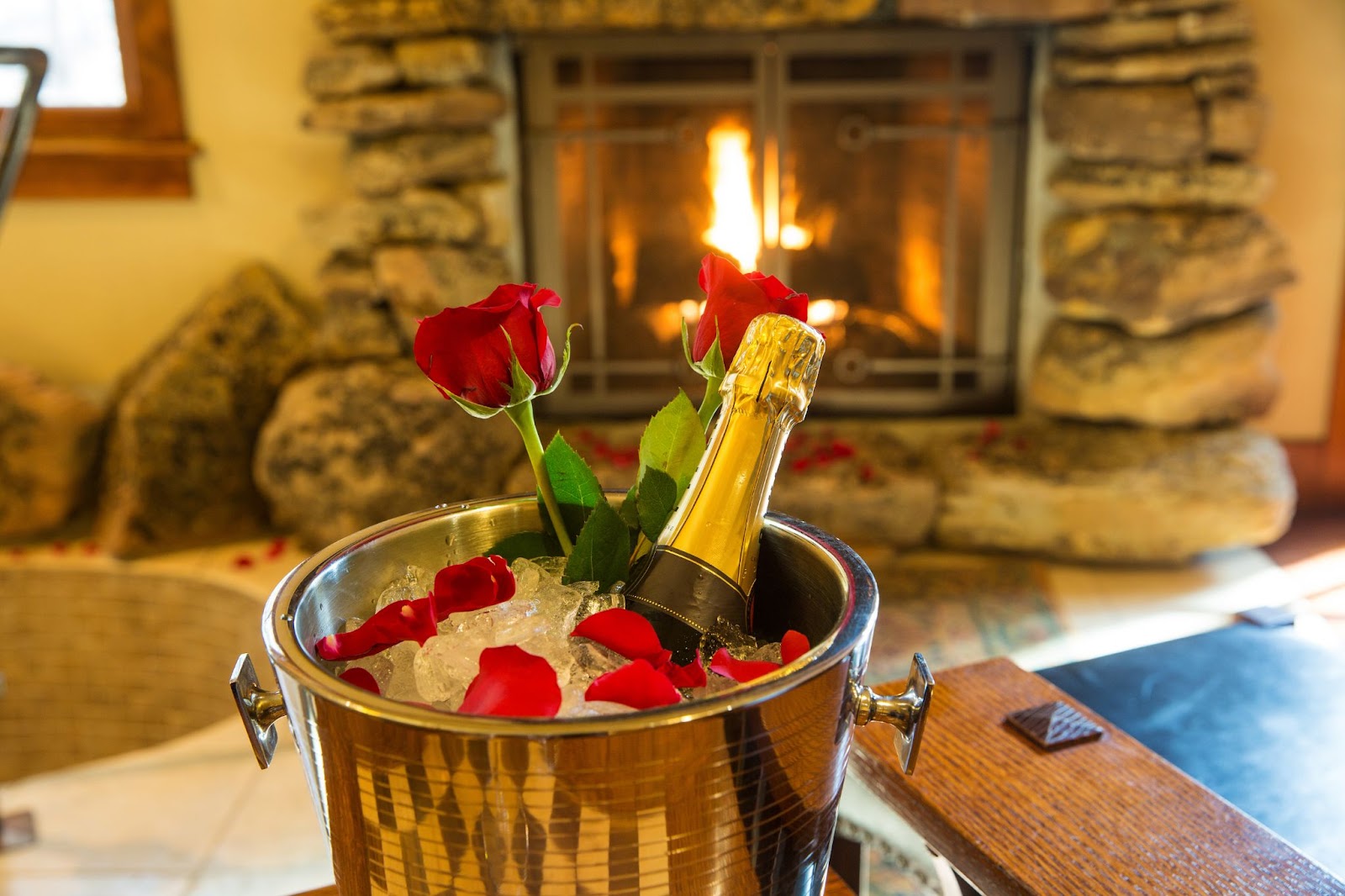 A bottle of champagne resting in an ice bucket, ready for celebration.